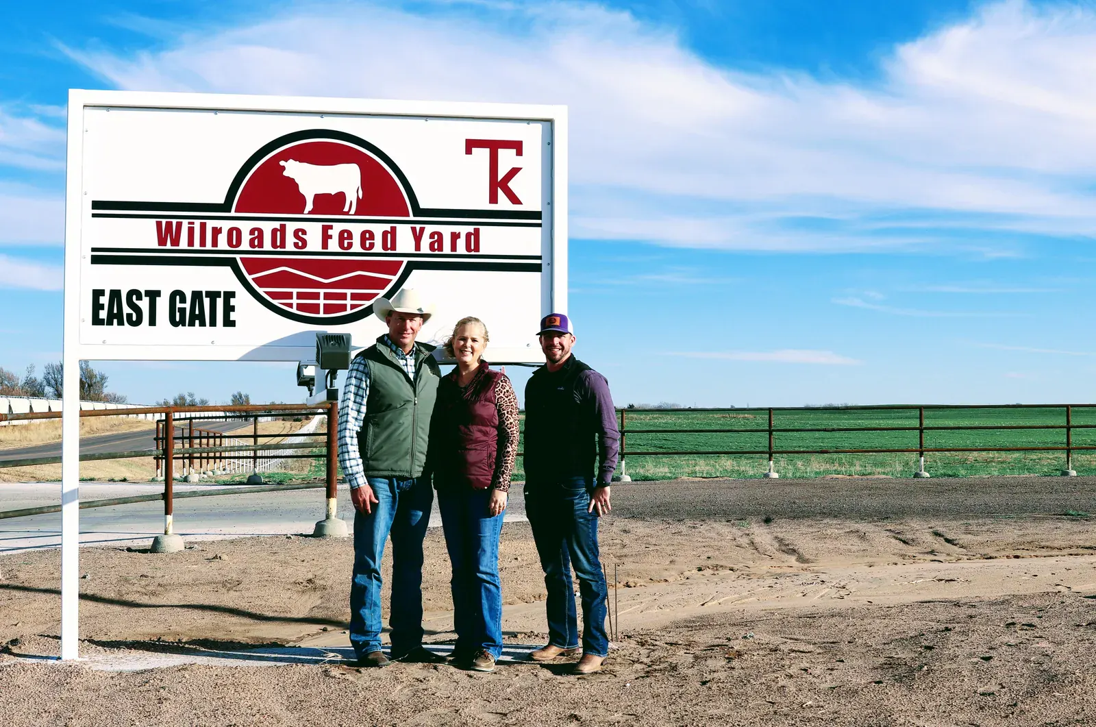 Wilroads East Gate sign with Wilroads leadership